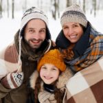 Happy Family Posing in Winter Forest